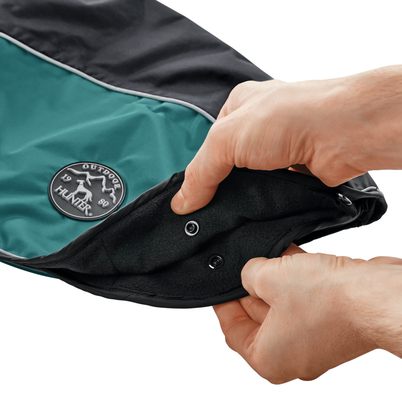 HUNTER Hundemantel Outdoor, Schwarz/Türkis, für Hunde, Schutz vor Kälte/Nässe, mit Druckknöpfen, HUNTER-Logo sichtbar.