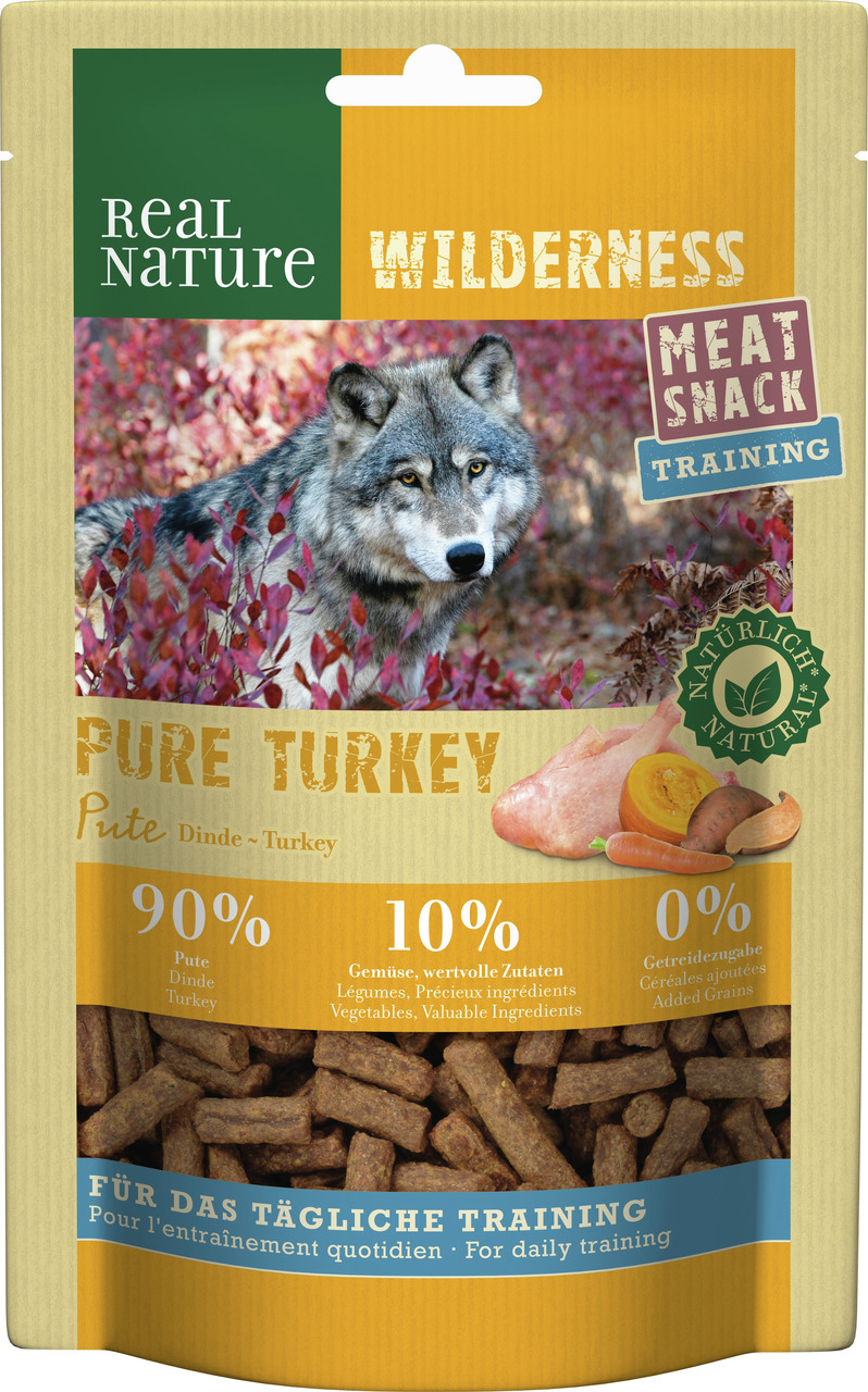 Das Bild zeigt die Verpackung des Produkts „REAL NATURE WILDERNESS Meat Snack Training Pure Turkey“. Es handelt sich um einen getreidefreien Trainingssnack für Hunde mit 90 % Pute, 10 % Gemüse und wertvollen Zutaten. Die Geschmacksrichtung ist Pute. Die V