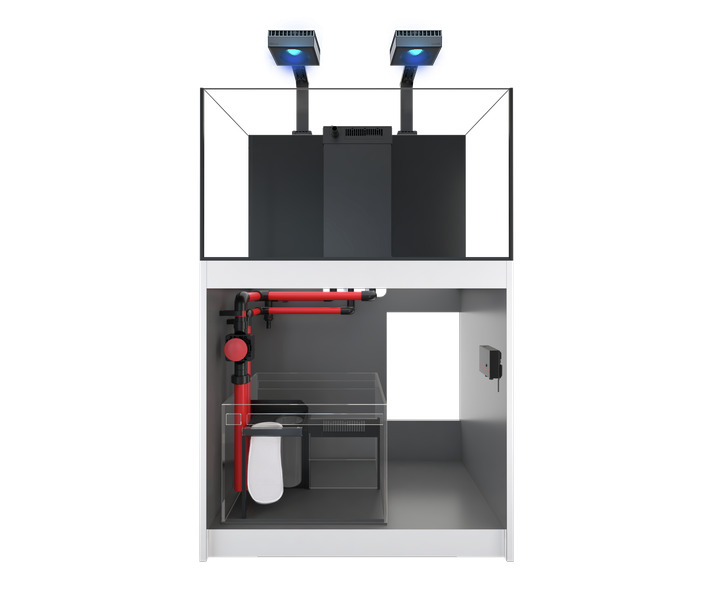 Das Bild zeigt das Red Sea Reefer Aquarium-System, ein hochwertiges Komplettsystem für Meerwasseraquarien. Es besteht aus einem modernen Unterschrank mit integriertem Filtersystem, roten Rohrleitungen und einem geräumigen Technikbecken. Oben befinden sich