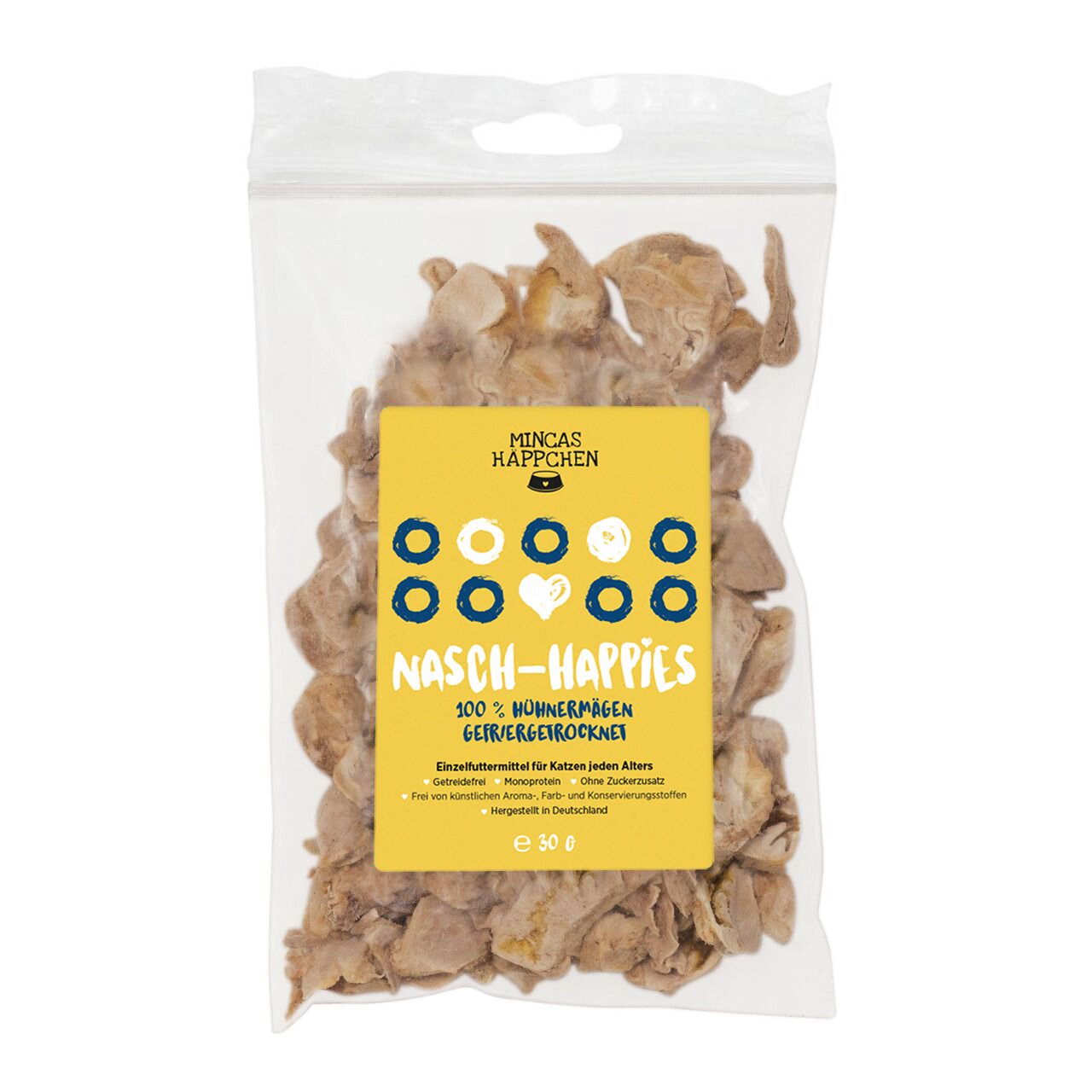 Das Bild zeigt eine transparente Verpackung mit der Aufschrift „MINCAS HÄPPCHEN Nasch-Happies“. Es handelt sich um gefriergetrocknete Hühnermägen als Einzelfuttermittel für Katzen jeden Alters. Die Verpackung enthält 30 g. Das Produkt ist getreidefrei, oh