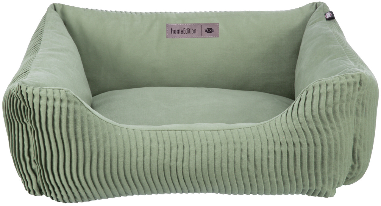 Grünes Hundebett der Marke TRIXIE aus der Home Edition, geeignet für kleine bis mittelgroße Hunde. Das Bett hat eine weiche Polsterung und gerippte Seitenwände für zusätzlichen Komfort. Es bietet eine gemütliche Liegefläche und passt durch das moderne Des
