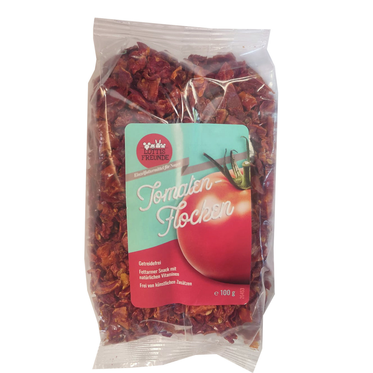 Das Bild zeigt eine transparente Verpackung des Produkts „Lottis Freunde Tomaten-Flocken“. Es handelt sich um ein Ergänzungsfuttermittel für Nager. Die Verpackung enthält 100 g getreidefreie, fettarme Tomatenflocken, die reich an natürlichen Vitaminen sin