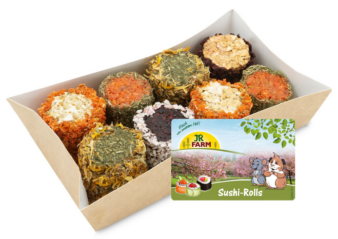 Das Bild zeigt die JR FARM Sushi-Rolls, ein hochwertiges Snack-Produkt für Kleintiere wie Kaninchen und Meerschweinchen. Die Packung enthält eine Auswahl an farbenfrohen, runden Snacks mit verschiedenen Zutaten wie Gemüse, Kräutern und Blüten. Die Geschma