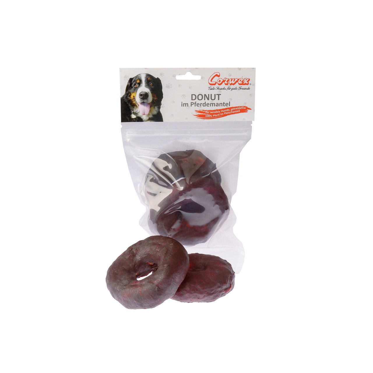Corwex Donut im Pferdemantel: Hundesnack f. erwachsene Hunde, 100 % Pferdefleisch, dunkelbraune Donuts in transparenter Tüte.