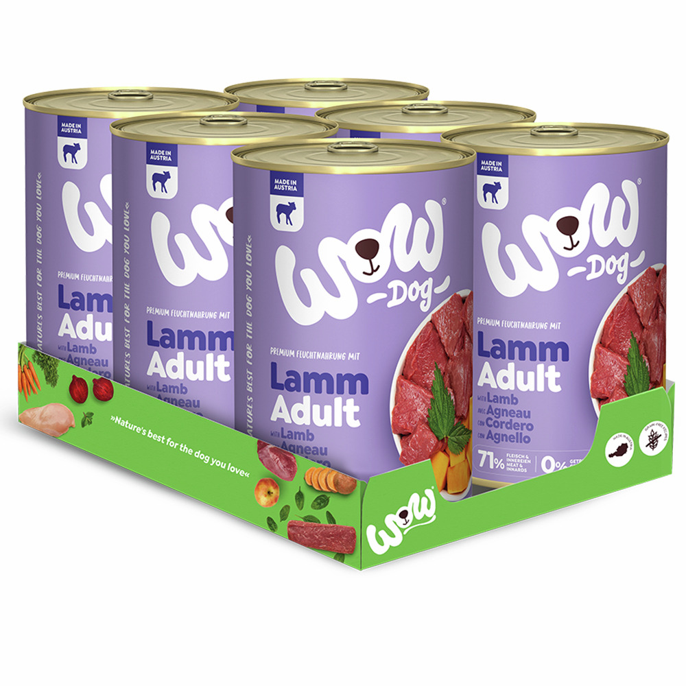 Sechs Dosen Hundefutter der Marke WOW DOG, Sorte „Lamm Adult“, in einer grünen Verpackung. Geeignet für ausgewachsene Hunde, Geschmacksrichtung Lamm. Enthält 71 % Fleischanteil, 100 % natürliche Zutaten. Verpackung zeigt frische Zutaten wie Karotten und Ä