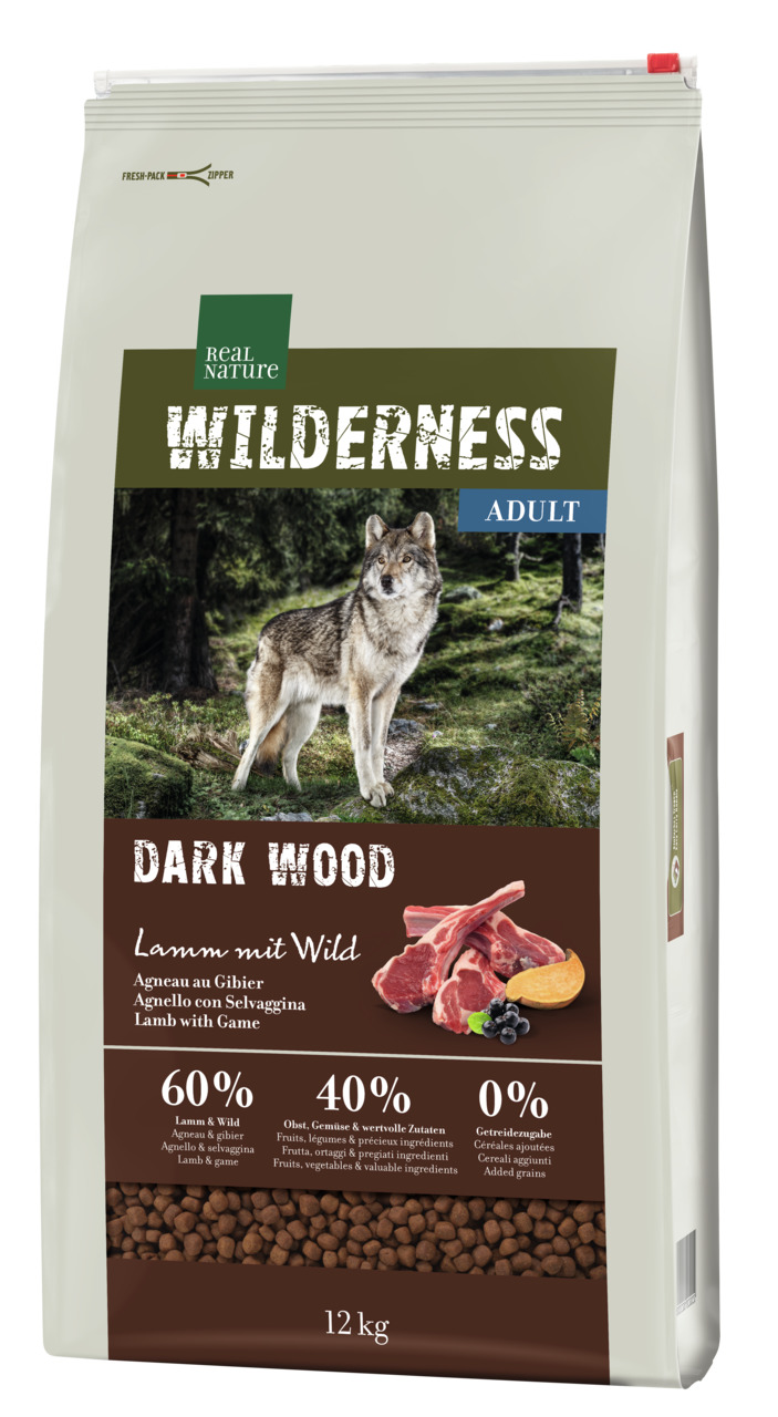 Das Bild zeigt eine 12-kg-Packung des Hundefutters „REAL NATURE WILDERNESS DARK WOOD“ für ausgewachsene Hunde. Die Geschmacksrichtung ist Lamm mit Wild. Das Futter enthält 60 % Lamm und Wild, 40 % Obst, Gemüse und wertvolle Zutaten sowie 0 % Getreidezusät
