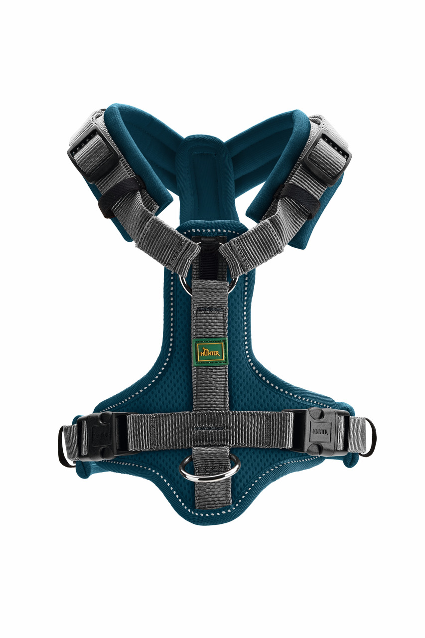 Das Bild zeigt ein hochwertiges, türkisfarbenes Hundegeschirr der Marke HUNTER, Modell Hilo Comfort. Es ist speziell für Hunde konzipiert und besteht aus atmungsaktivem Mesh-Material mit grauen, verstellbaren Gurten für optimalen Tragekomfort. Das Geschir