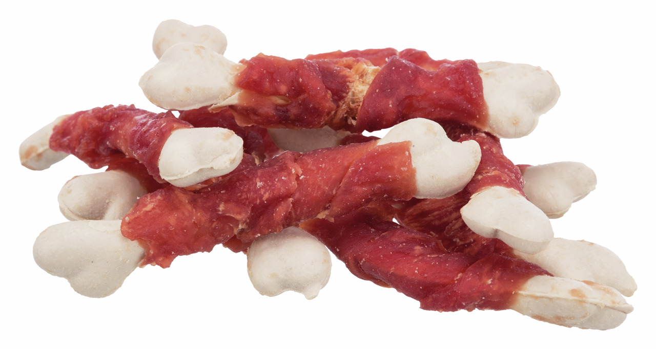 Ein Stapel TRIXIE Kauknochen mit Hühnerfleisch für Hunde. Die weißen Kauknochen sind mit rotem, getrocknetem Hühnerfleisch umwickelt. Ideal als Snack oder Belohnung für Hunde. Geschmacksrichtung: Huhn. Zielgruppe: Hunde. Menge: Mehrere Kauknochen sichtbar
