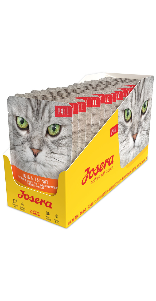 Das Bild zeigt eine gelbe Verpackungseinheit von Josera Paté Katzenfutter mit der Geschmacksrichtung Huhn mit Spinat. Die Zielgruppe sind Katzen. Auf der Verpackung sind mehrere Portionsbeutel mit einem Katzenmotiv und grünen Augen abgebildet. Die Menge u