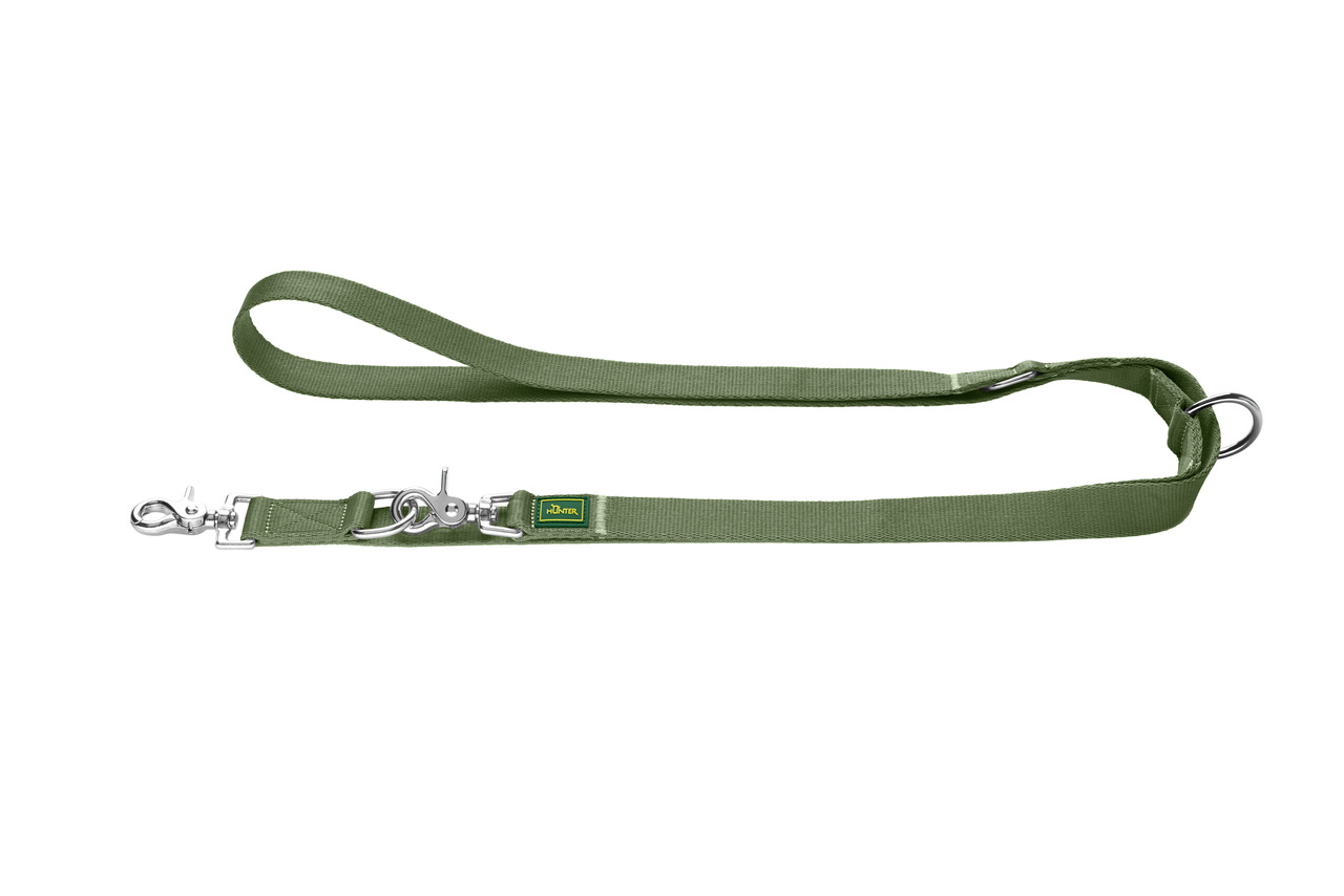 Grüne Hundeleine der Marke HUNTER, Modell "Tripoli", geeignet für Hunde aller Größen. Die Leine besteht aus robustem Nylonmaterial und verfügt über zwei verstellbare Karabinerhaken aus Metall. Ideal für Spaziergänge und Training. Länge ca. 200 cm, Breite 
