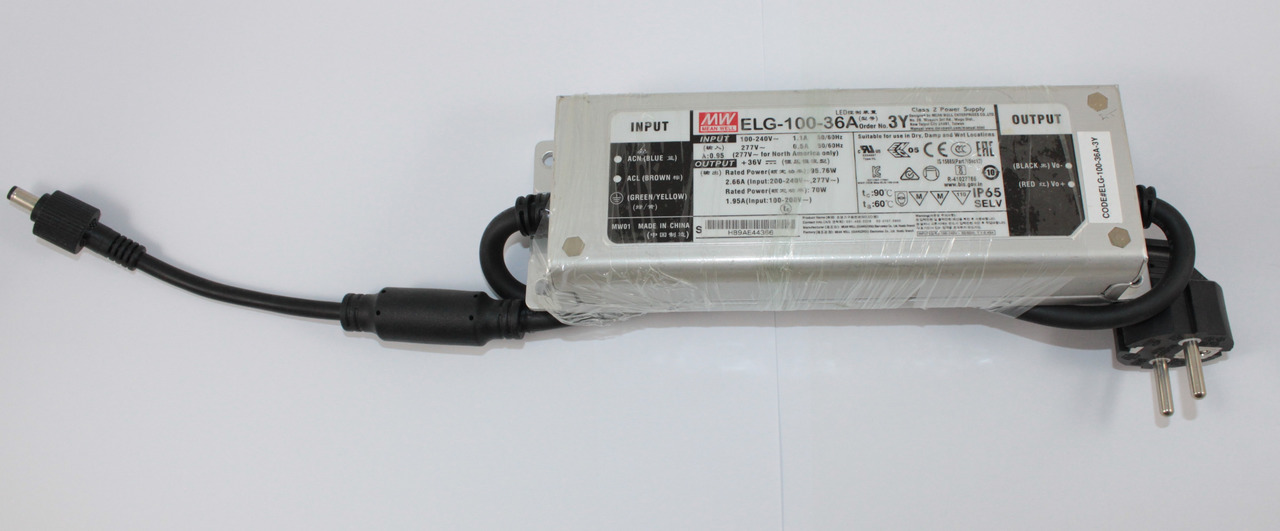 Netzteil Mean Well ELG-100-36A, silbernes Gehäuse, EU-Netzkabel, DC-Ausgang, techn. Spezifikationen u. Sicherheitskennz. sichtbar.