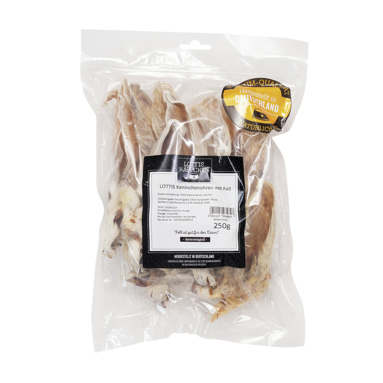 Das Bild zeigt eine transparente Verpackung mit der Aufschrift „LOTTIS Kaninchenohren mit Fell“. Die Marke „LOTTIS HÄPPCHEN“ bietet dieses Produkt speziell für Hunde an. Es handelt sich um 250 g getrocknete Kaninchenohren mit Fell, die als natürlicher Kau