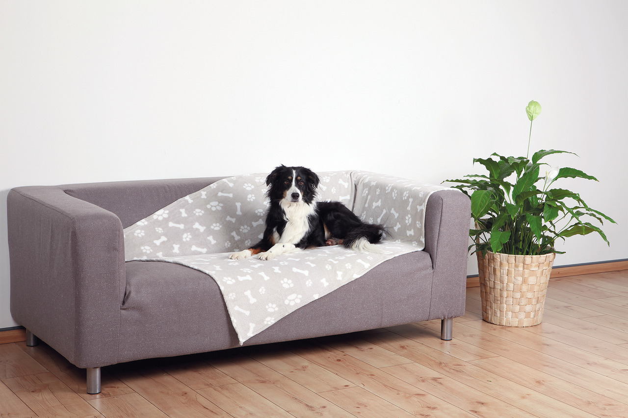 TRIXIE Sofadecke für Hunde, beige mit Pfoten- & Knochenmuster, schützt Möbel vor Schmutz & Haaren, ideal für mittelgroße Hunde.