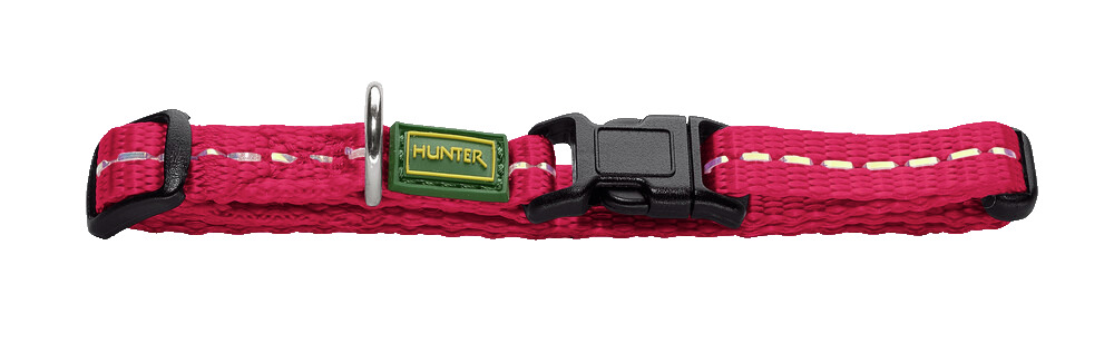Das Bild zeigt ein leuchtend pinkfarbenes Hundehalsband der Marke HUNTER, Modell Tripoli, mit einem stabilen Kunststoffverschluss und einem grünen Markenlogo. Es ist für Hunde geeignet und bietet durch die reflektierenden Nähte zusätzliche Sicherheit bei 