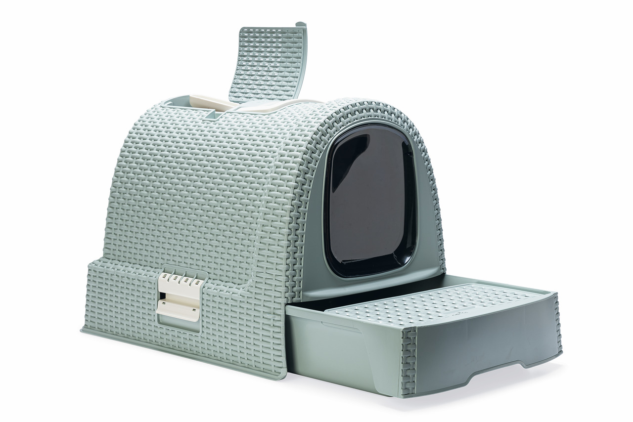 Das Bild zeigt die Curver Katzentoilette aus Kunststoff in einem eleganten Rattan-Design und einer hellgrünen Farbe. Sie ist für Katzen als Zielgruppe konzipiert und verfügt über eine Schublade zur einfachen Reinigung sowie eine Klapptür für Privatsphäre.