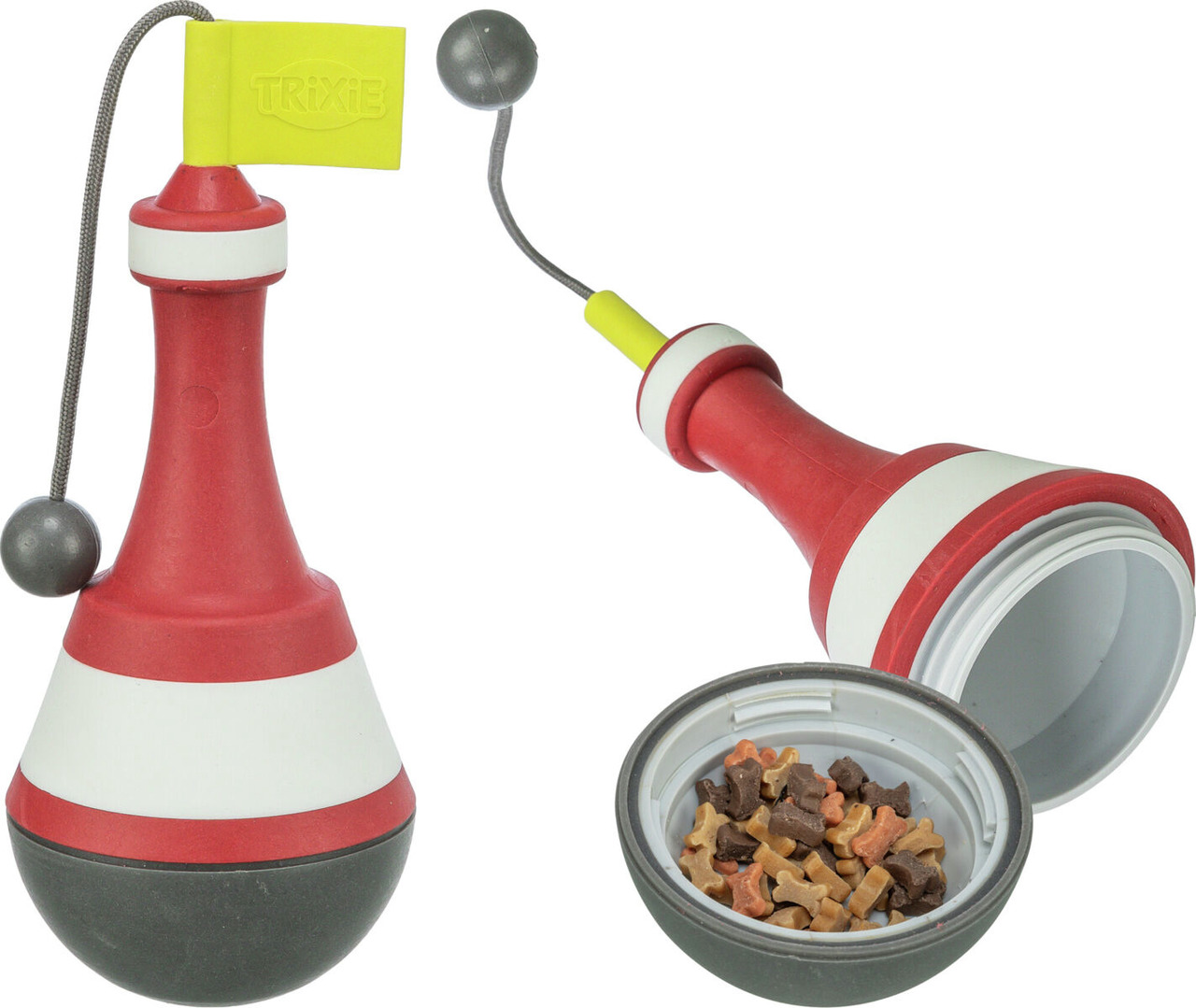 Das Bild zeigt das TRIXIE Dog Activity Snack-Spielzeug, ein interaktives Beschäftigungsspielzeug für Hunde. Es besteht aus einem rot-weiß-schwarzen Kunststoffkörper in Form einer Boje mit einer gelben Fahne und einer Schnur mit Kugel. Der untere Teil ist 