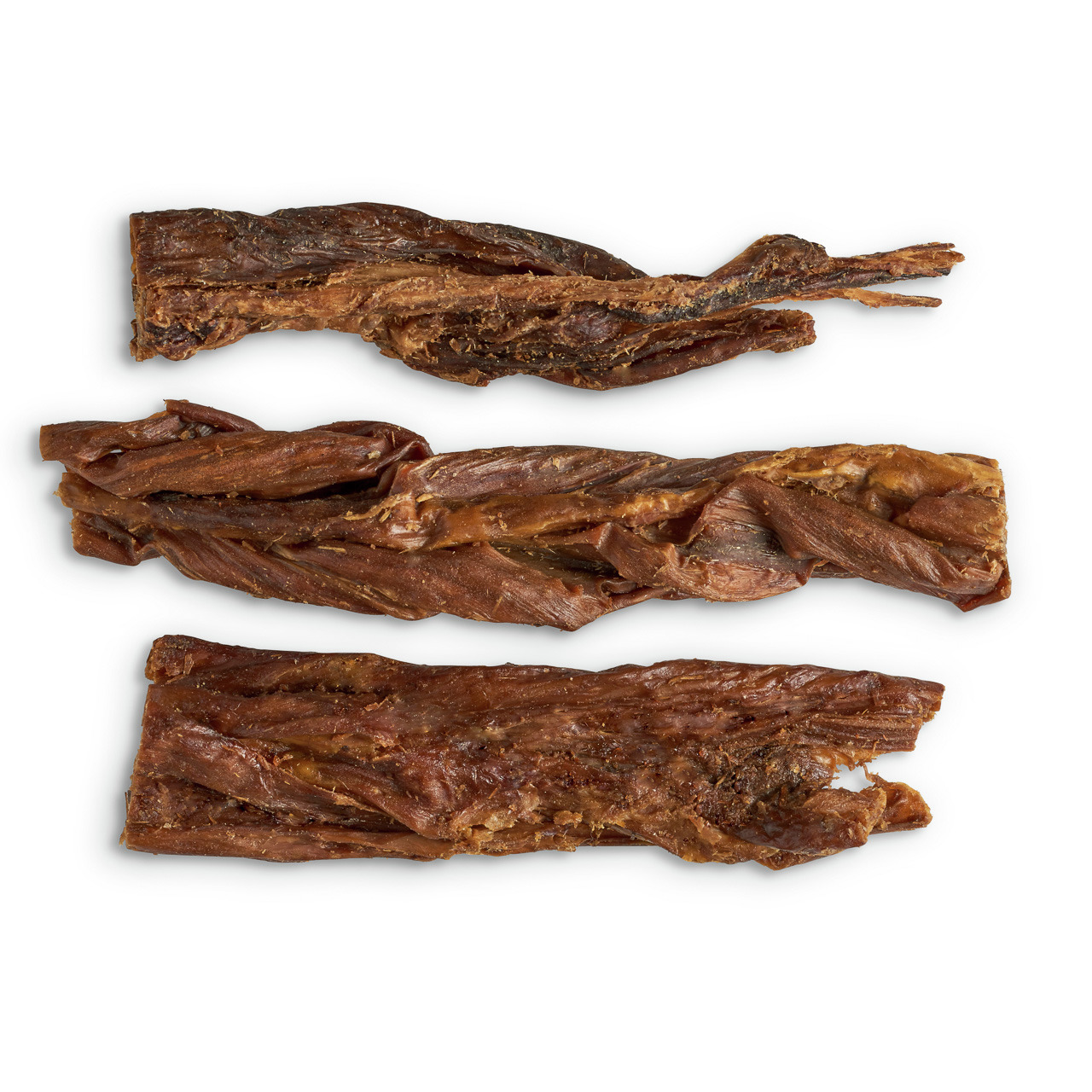 Auf dem Bild sind drei Stücke getrockneter Rinderhaut zu sehen, die als natürlicher Kausnack für Hunde dienen. Es handelt sich um das Produkt „Lottis Häppchen Rinderhaut“, geeignet für Hunde aller Größen. Der Snack ist fettarm, unterstützt die Zahnpflege 