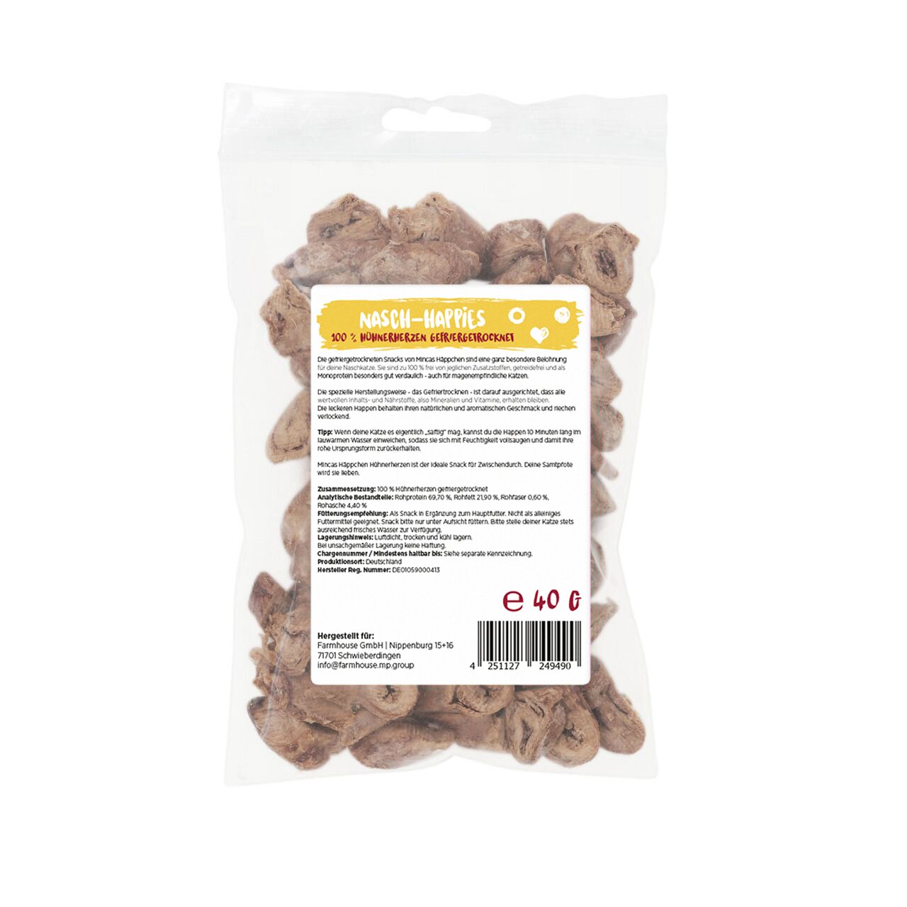 Das Bild zeigt eine transparente Verpackung mit der Aufschrift „Nasch-Happies – 100 % Hühnerherzen gefriergetrocknet“. Es handelt sich um ein Produkt der Marke MINCAS HÄPPCHEN, speziell für Hunde. Die Packung enthält 40 g gefriergetrocknete Hühnerherzen, 