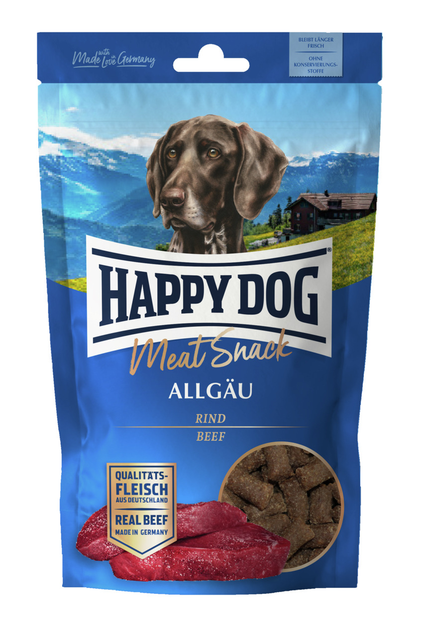 Das Bild zeigt eine Verpackung des Produkts „HAPPY DOG Meat Snack Allgäu“ für Hunde. Die Zielgruppe sind Hundehalter, die ihren Tieren hochwertige Snacks anbieten möchten. Der Snack besteht aus Rindfleisch („Beef“) und wird mit „Qualitätsfleisch aus Deuts