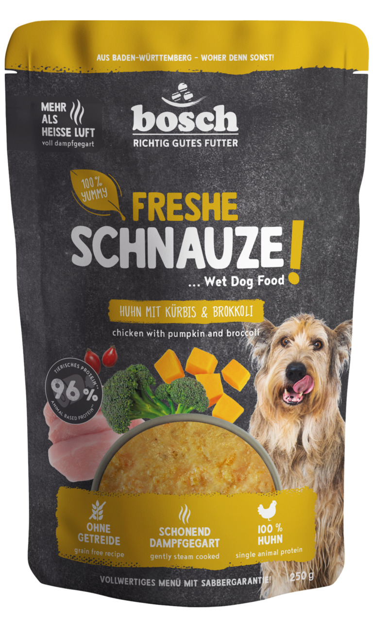 Das Bild zeigt eine Verpackung des Hundefutters „Freshe Schnauze!“ von Bosch Tiernahrung. Es handelt sich um ein Nassfutter für Hunde mit der Geschmacksrichtung Huhn, Kürbis und Brokkoli. Die Rezeptur ist ohne Getreide, schonend dampfgegart und enthält 10