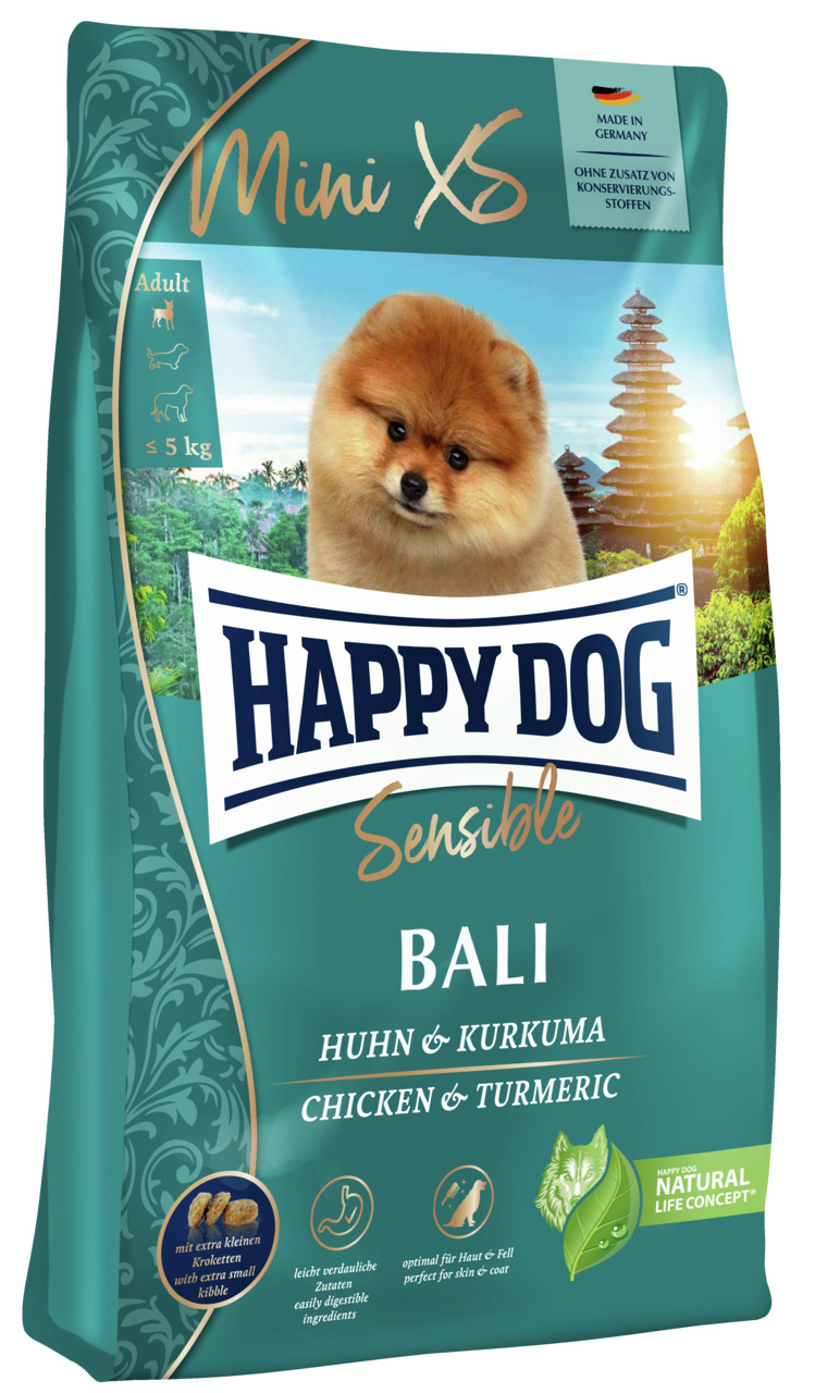 Das Bild zeigt eine Verpackung des Hundefutters „HAPPY DOG Sensible Bali“ der Marke HAPPY DOG. Es handelt sich um ein Premium-Trockenfutter für ausgewachsene Hunde kleiner Rassen bis 5 kg. Die Geschmacksrichtung ist Huhn und Kurkuma. Die Verpackung enthäl