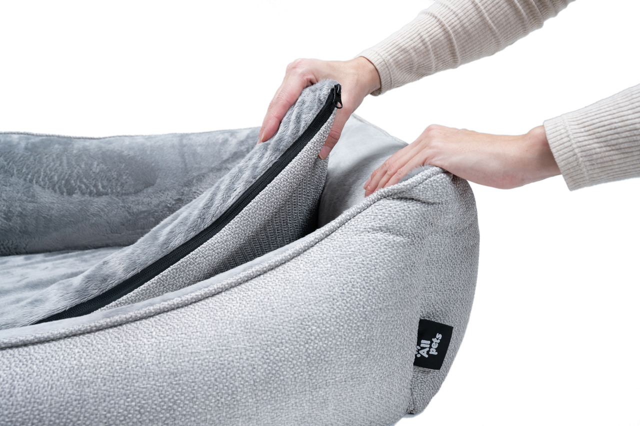Das Bild zeigt ein hochwertiges, graues Haustierbett der Marke Allpets mit abnehmbarem, waschbarem Bezug. Es ist speziell für Hunde und Katzen geeignet und bietet durch das weiche, plüschartige Innenmaterial hohen Komfort. Die Reißverschlussfunktion erlei