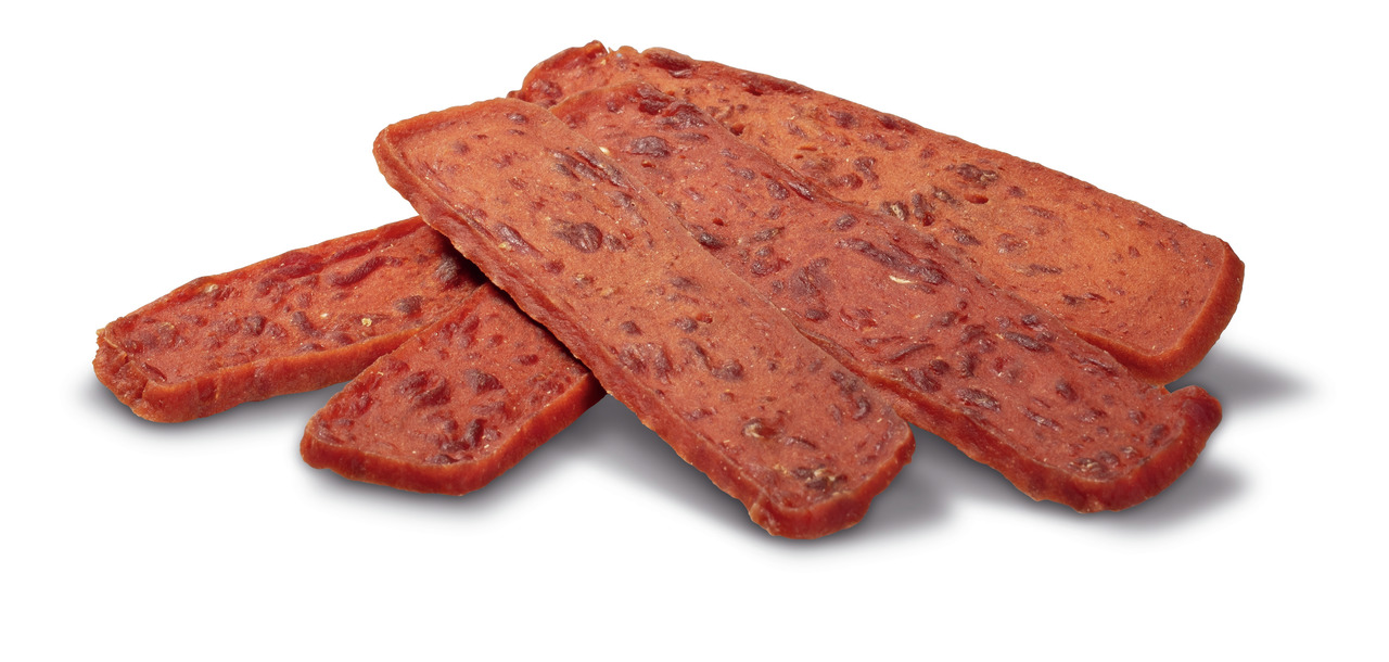 PREMIERE Snack Strauß, Hundesnack f. erw. Hunde, Straußenfleisch, proteinreich, fettarm, rötlich-braune Streifen, strukturierte Oberfläche.