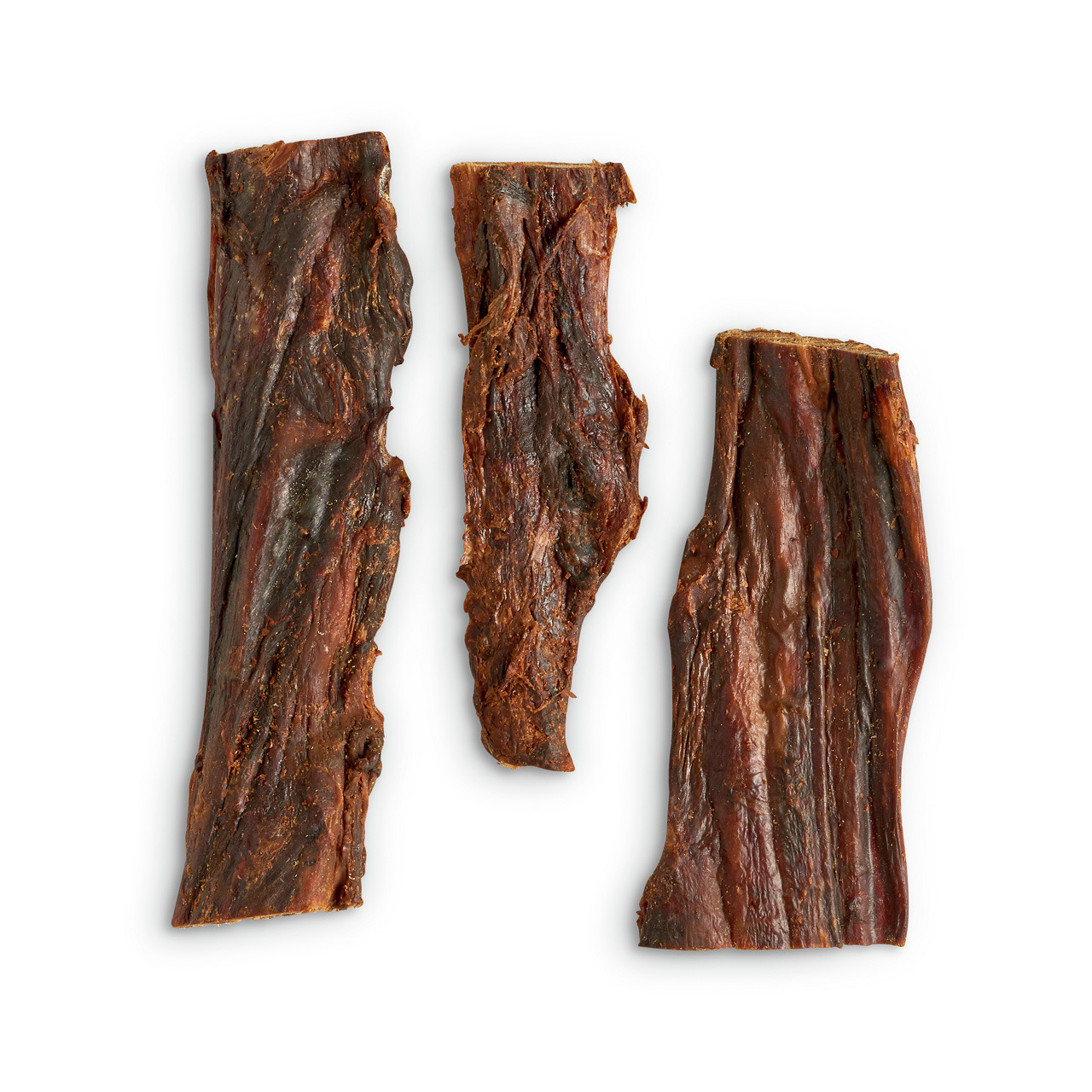 Das Bild zeigt drei Stücke von LOTTIS HÄPPCHEN Rinderhaut, einem natürlichen Kausnack für Hunde. Die Zielgruppe sind Hunde aller Größen und Rassen. Die Geschmacksrichtung ist Rind, und das Produkt bietet eine langanhaltende Beschäftigung sowie Zahnpflege.