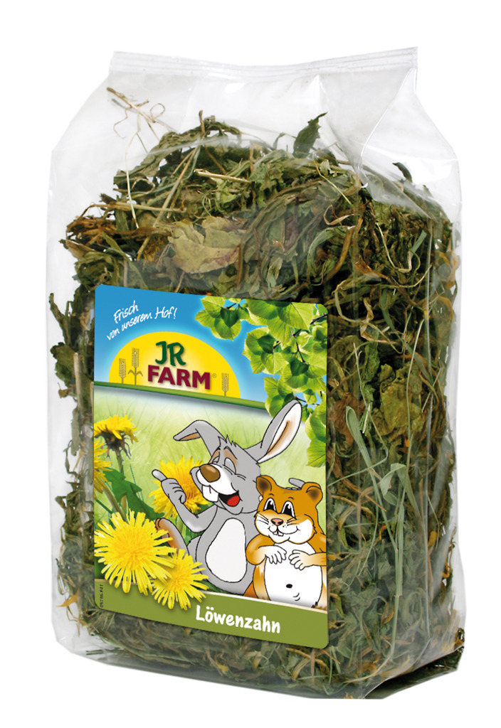 Das Bild zeigt eine transparente Verpackung des Produkts „JR FARM Löwenzahn“, das speziell für Kleintiere wie Kaninchen und Hamster entwickelt wurde. Die Verpackung enthält getrockneten Löwenzahn, der als gesunder Snack dient. Auf der Vorderseite sind ein