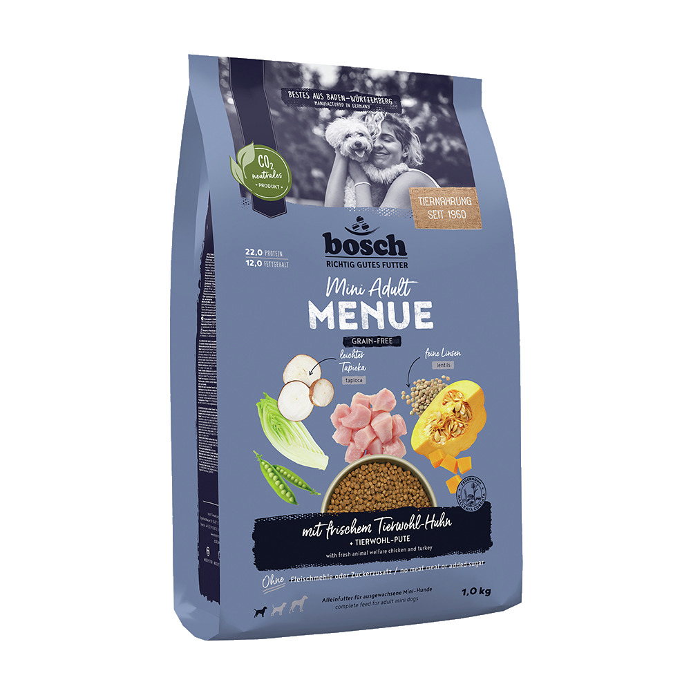 Das Bild zeigt eine Verpackung des Hundefutters „bosch Mini Adult Menue“ in der Geschmacksrichtung „frisches Tierwohl-Huhn“ mit Truthahn. Es ist getreidefrei und für ausgewachsene Hunde kleiner Rassen geeignet. Die Verpackung enthält 1,0 kg Futter und heb